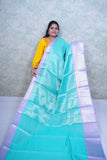 Enchanting Teal Kattan Silk Saree with Lavender Border & Brocade Blouse