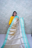 Luminous Light Golden Kattan Silk Saree with Teal Blue Border & Brocade Blouse